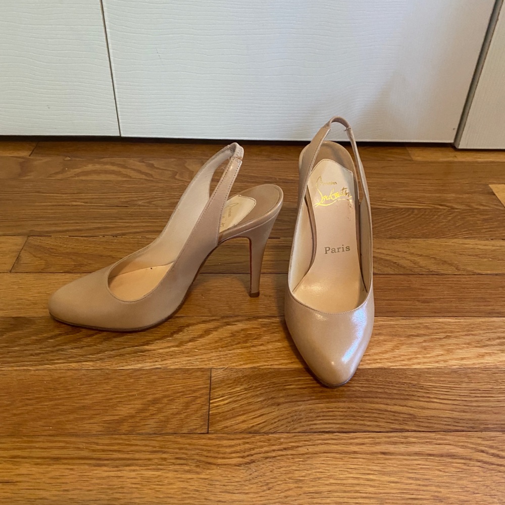 Tan slingback shoe with red bottom
